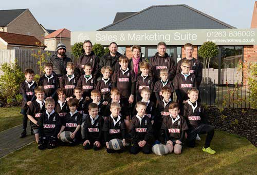 26012000 Holt RFC Players And Coaches Pictured With Sales Executive Susie Hamilton Outside The Sales And Marketing Suite At Heath Farm