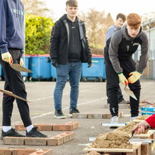 Students With Tommy Salmon From Lovell At The Bricklaying Session